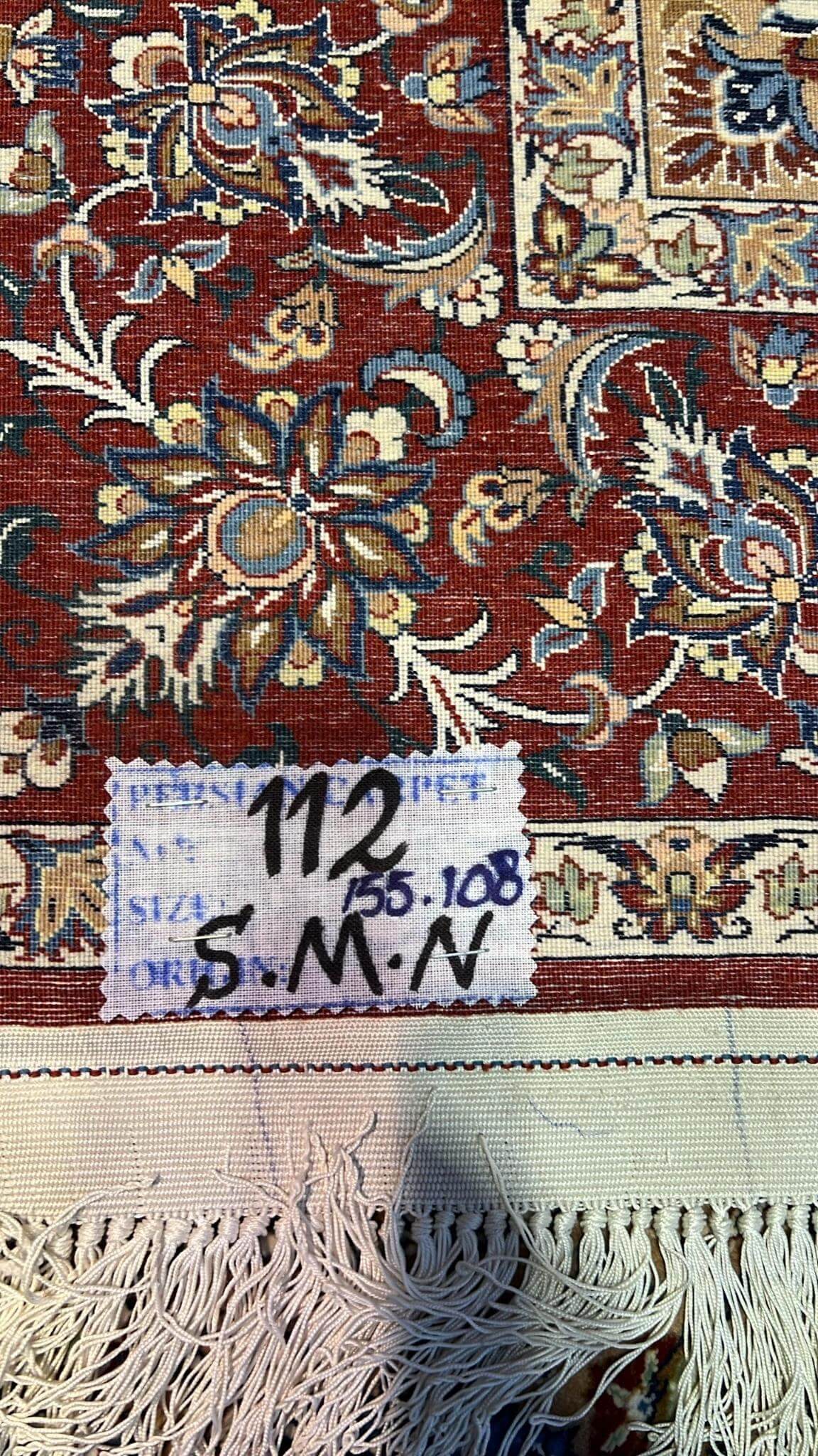 "Backside of a hand-knotted Seirafian Persian rug, highlighting the fine silk warp and precise craftsmanship typical of Isfahan rugs."